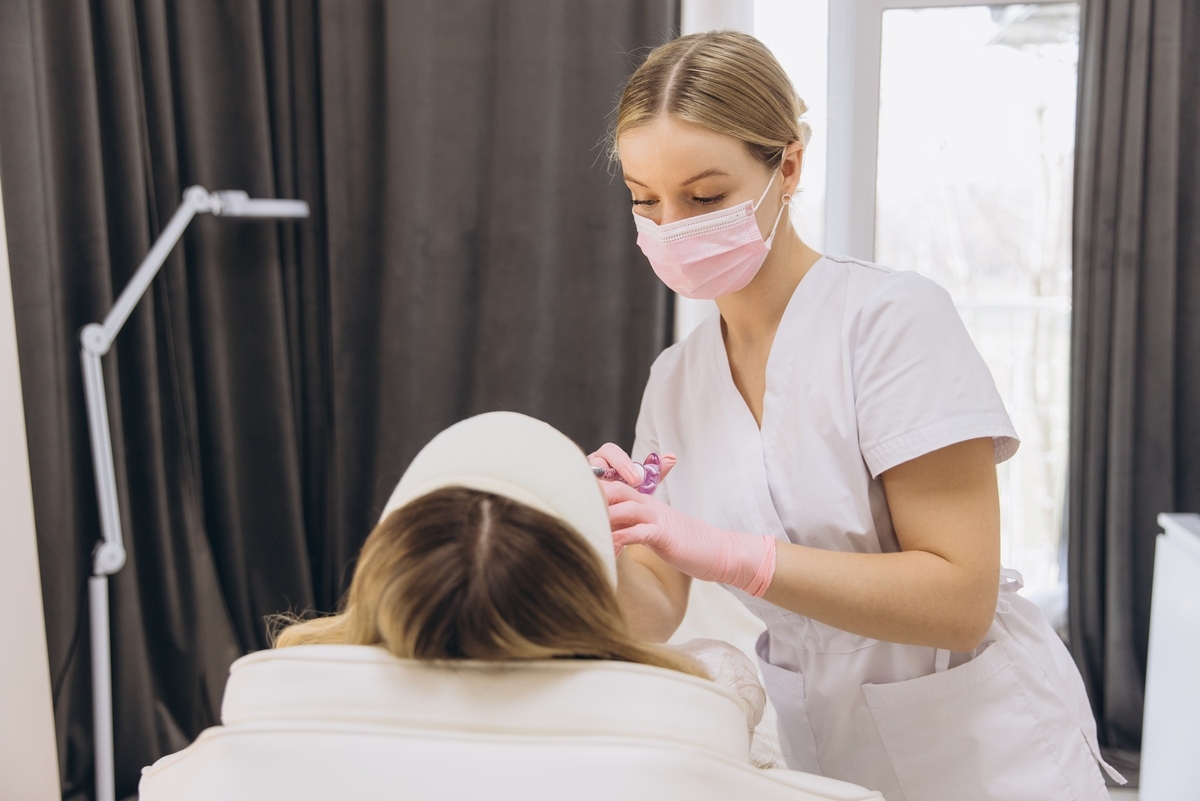 Provider administering an injection during a patient's first Botox appointment